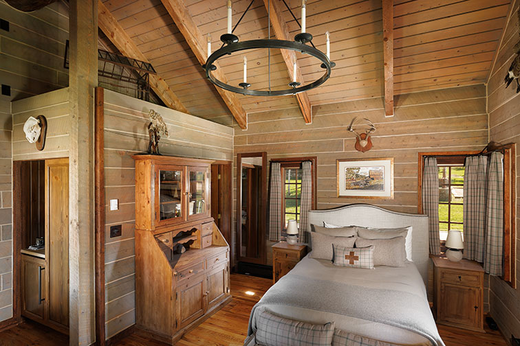 Cozy bedroom of a guest cabin at The Home Ranch in Colorado.