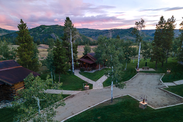 The grounds of a cozy guest cabin with rustic charm at The Home Ranch in Colorado.