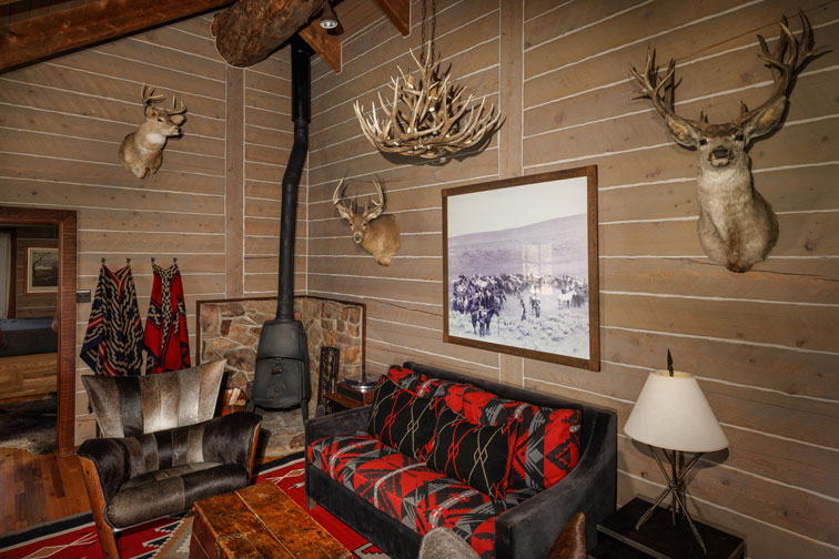 The living area of a family cabin at The Home Ranch in Colorado.