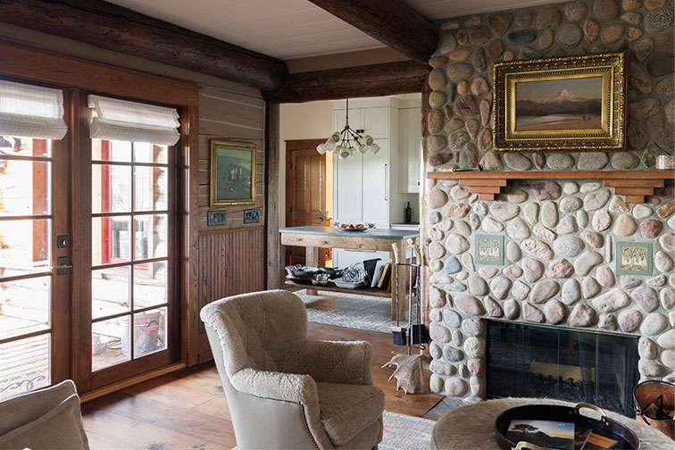 A cozy stone fireplace in luxury Home Ranch cabin in Clark, Colorado.