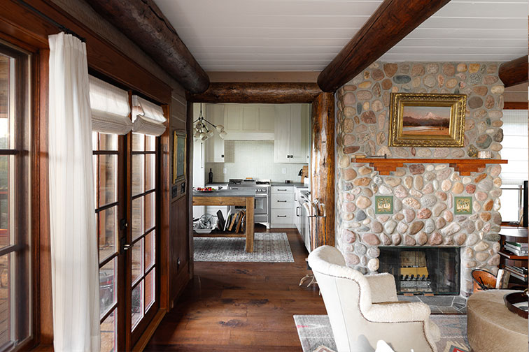 A cozy stone fireplace in luxury Home Ranch cabin in Clark, Colorado.