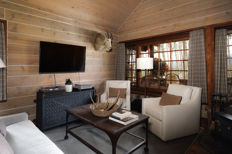 The cozy interior of a guest cabin at The Home Ranch in Colorado.