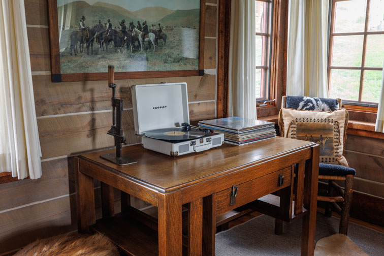 The retro record player in a cozy guest cabin at The Home Ranch in Colorado.