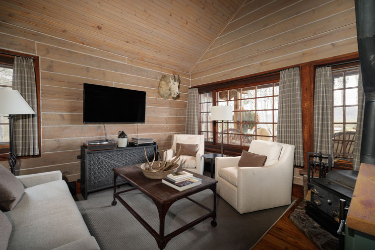 The interior living area of a hideaway cabin at The Home Ranch in Colorado.