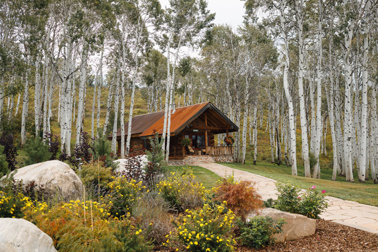 Exterior of a cozy hideaway cabin at The Home Ranch in Colorado.