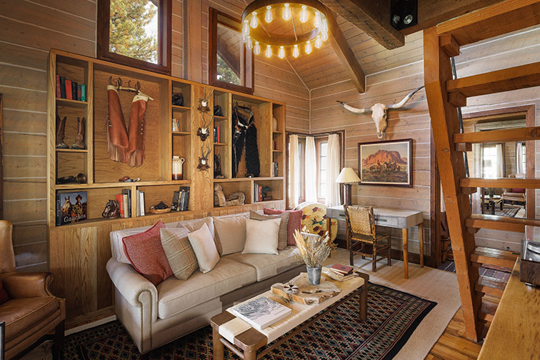 Living area of a luxury traditional wood cabin in Clark, Colorado.