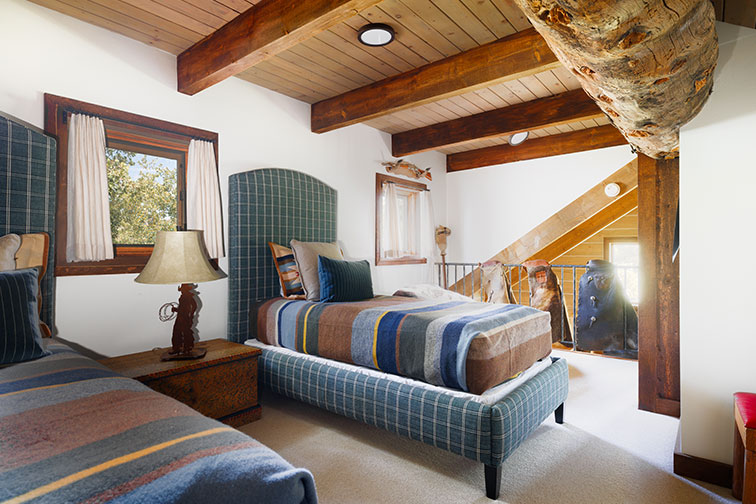 Second bedroom of a luxury traditional wood cabin in Clark, Colorado.