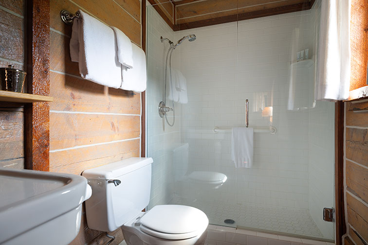 Shower and bathroom amenities of the cozy guest cabin at The Home Ranch.