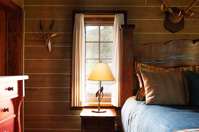 Bedroom interior of the cozy guest cabin at The Home Ranch.