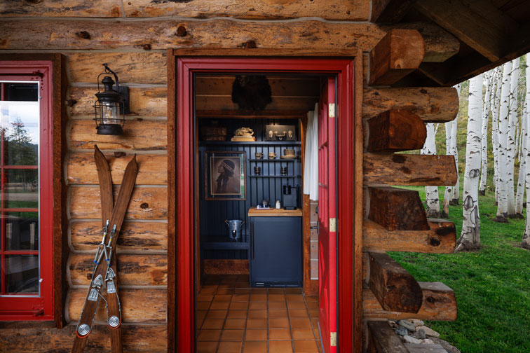 The interior of a romantic guest cabin at the Home Ranch in Colorado.