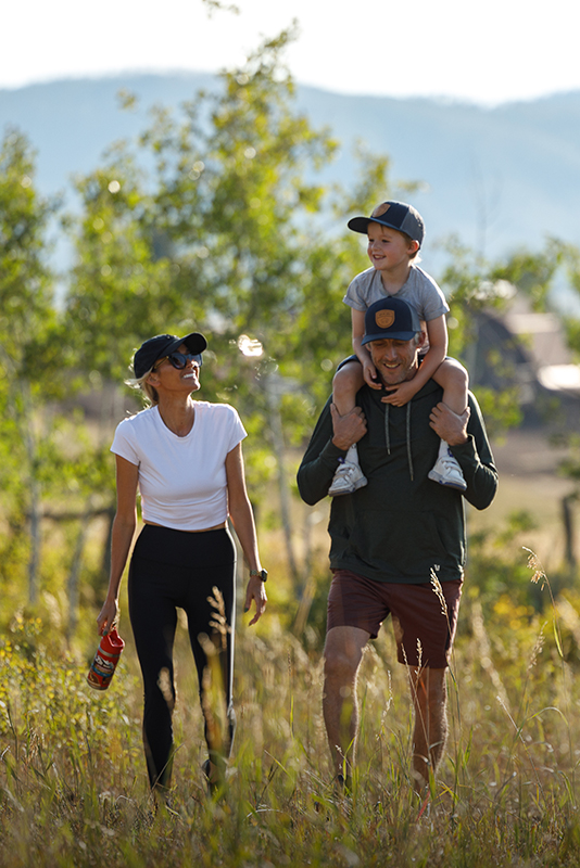 A family hiking at The Home Ranch in Clark, Colorado.