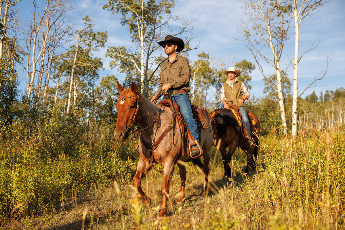 Horseback riding on the trails of The Home Ranch in Colorado.