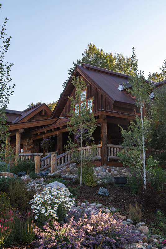 The exterior of the rustic-luxe guest house at The Home Ranch in Colorado.