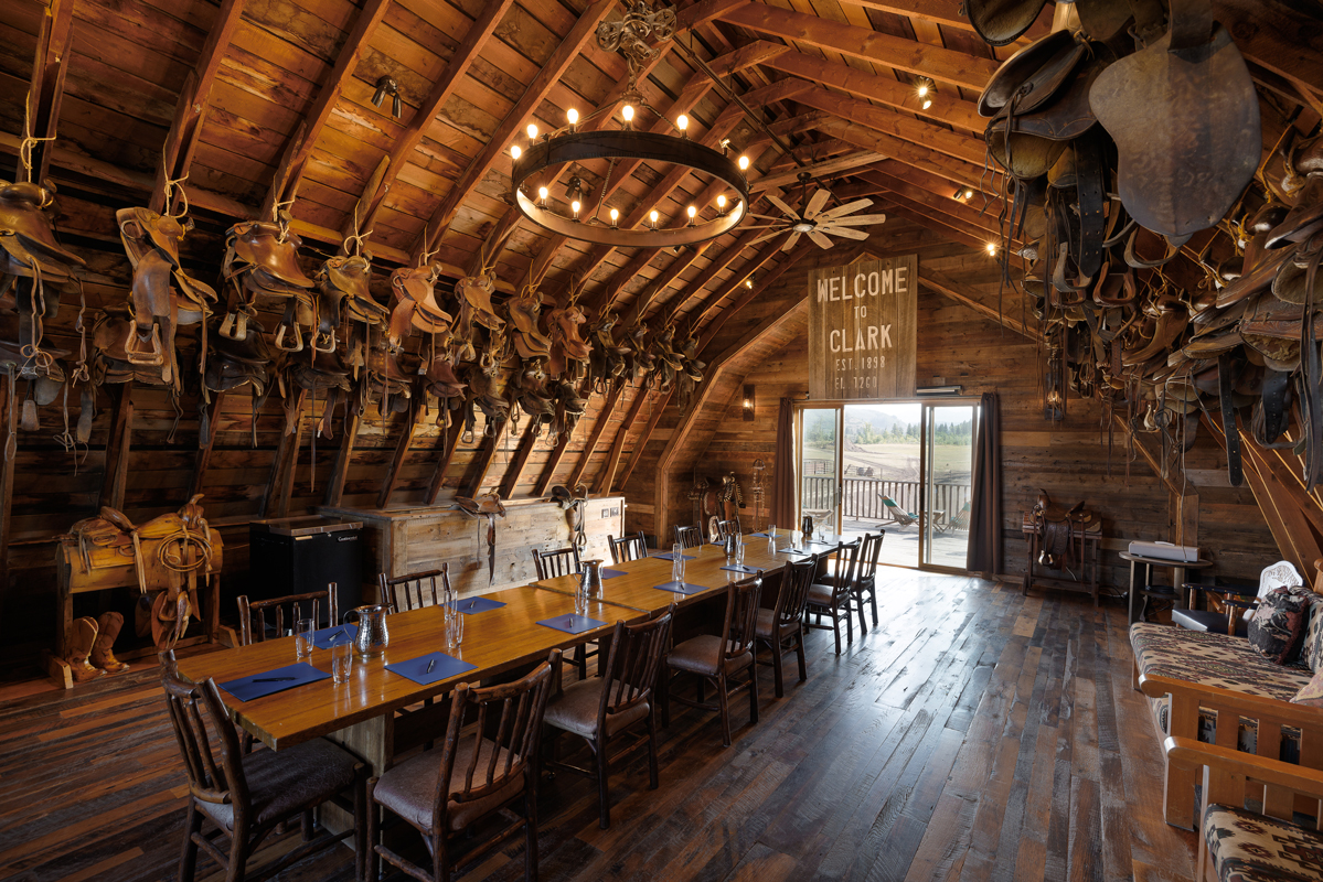 Hahn's Peak Barn at The Home Ranch is adorned with suspended saddles that make a big equestrian statement, the newly renovated historic barn also boasts a dance hall.