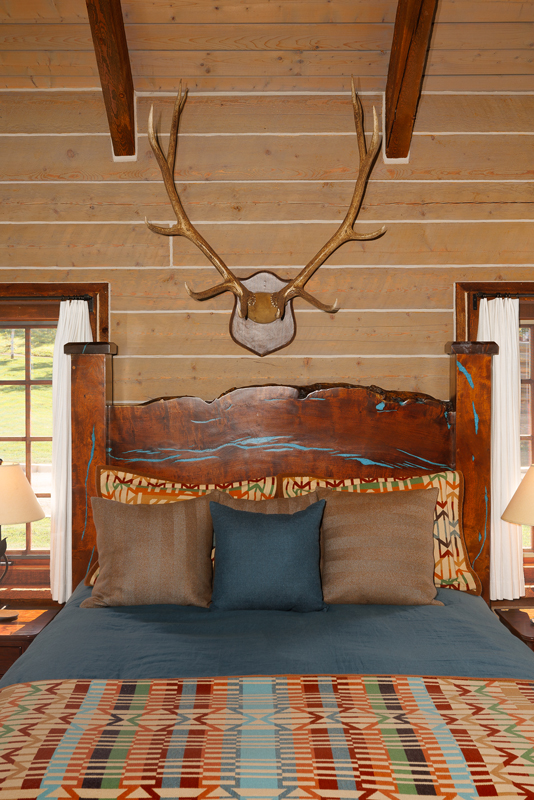 The cabin’s queen-size bed is a cozy place to wind down after a day of adventure.