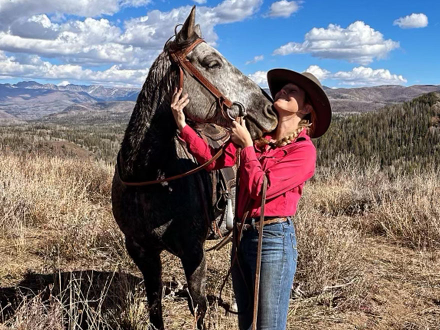 The Home Ranch's ranch horse, Smooch, is a beautiful Grey Quarter Horse who is as tough as they come.