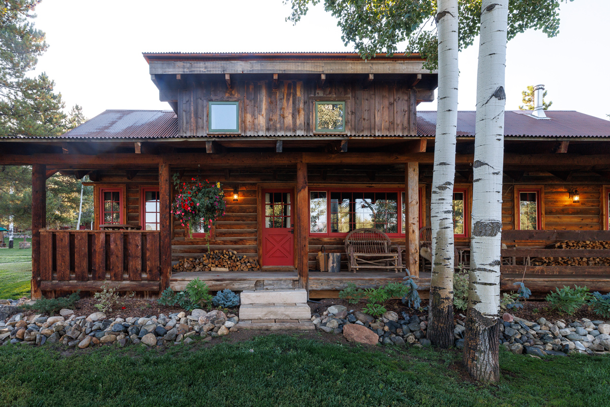 Exterior and grounds of a cozy guest cabin at The Home Ranch in Colorado.