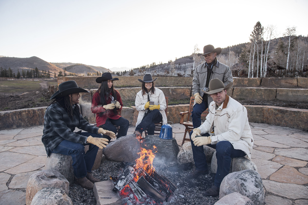 groups of people around campfire