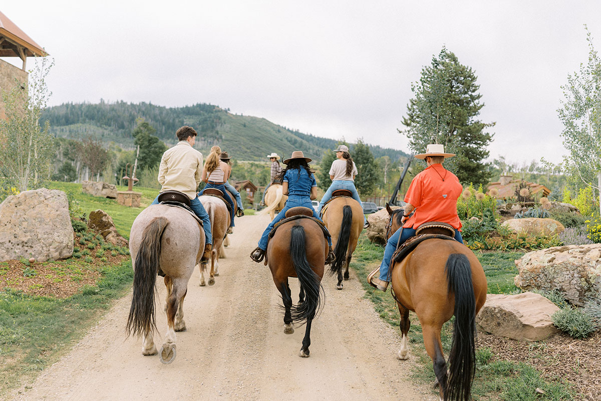 Horseback riding on the trails of The Home Ranch in Colorado.