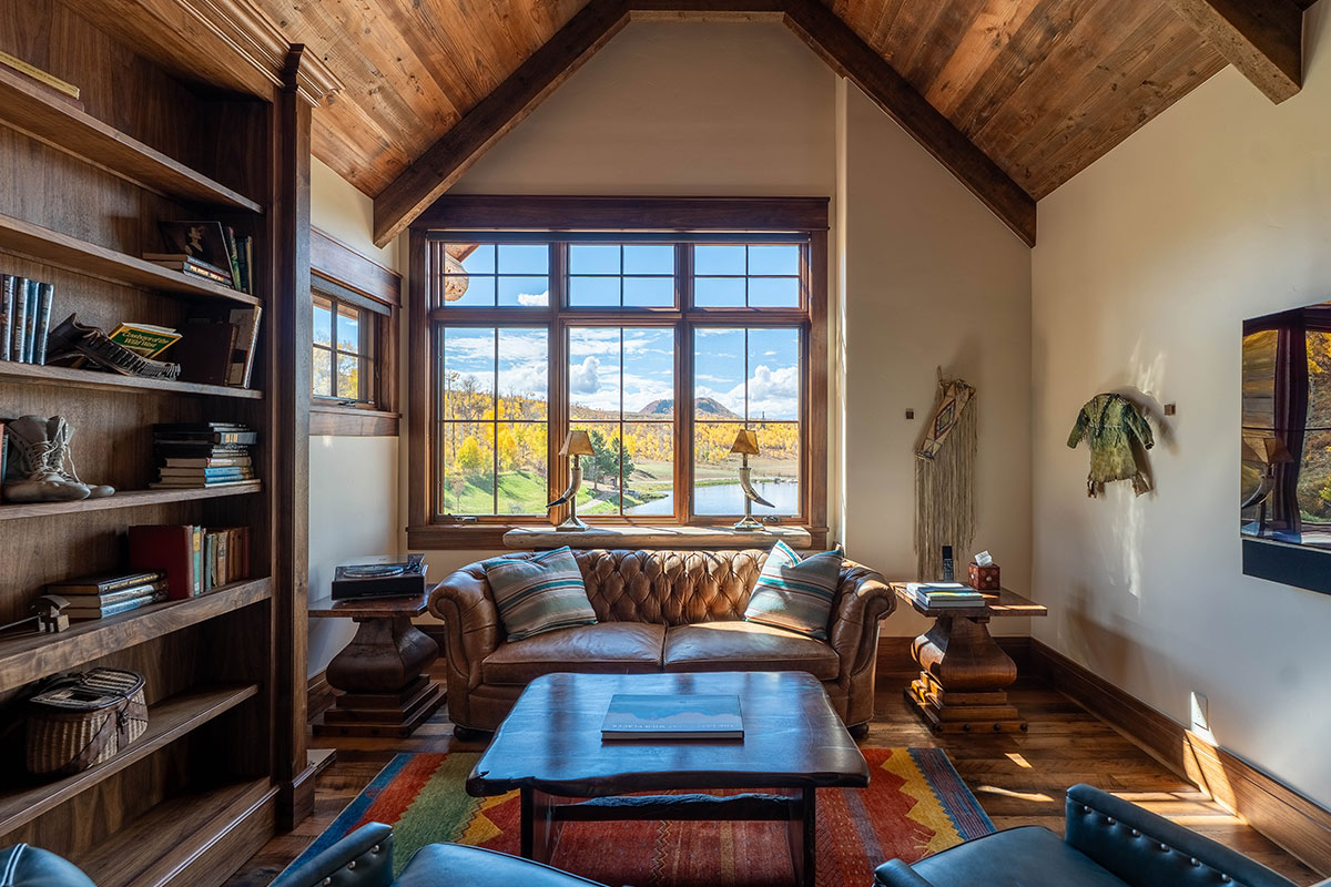 Cozy seating area of The Lodge, a two-room suite at The Home Ranch in Colorado.