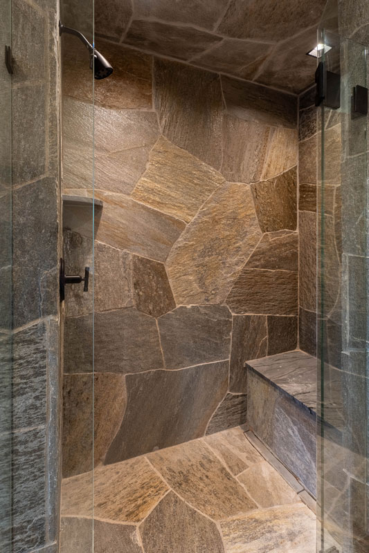 Stone shower inside the Hideaway suite at The Lodge, a two-room suite at The Home Ranch in Colorado.