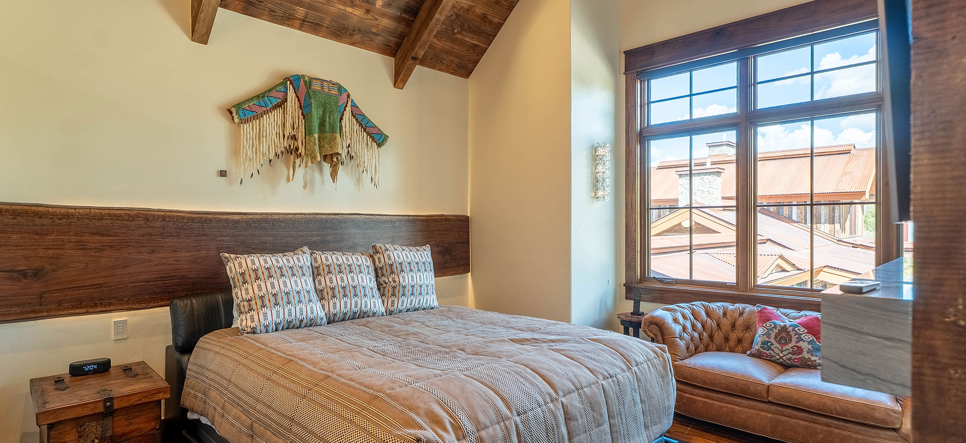 Bedroom inside the Hideaway suite at The Lodge, a two-room suite at The Home Ranch in Colorado.