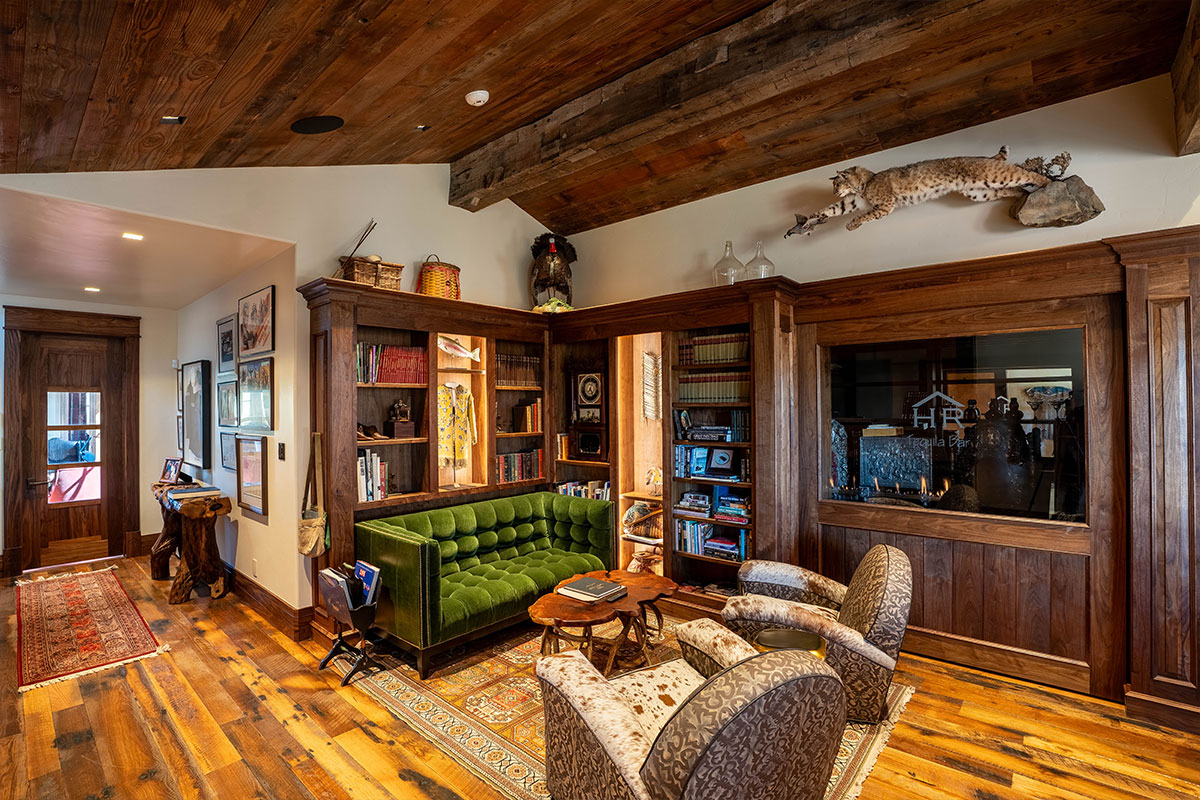 Lush velvet couch area with Native American art at The Home Ranch in Clark, Colorado.